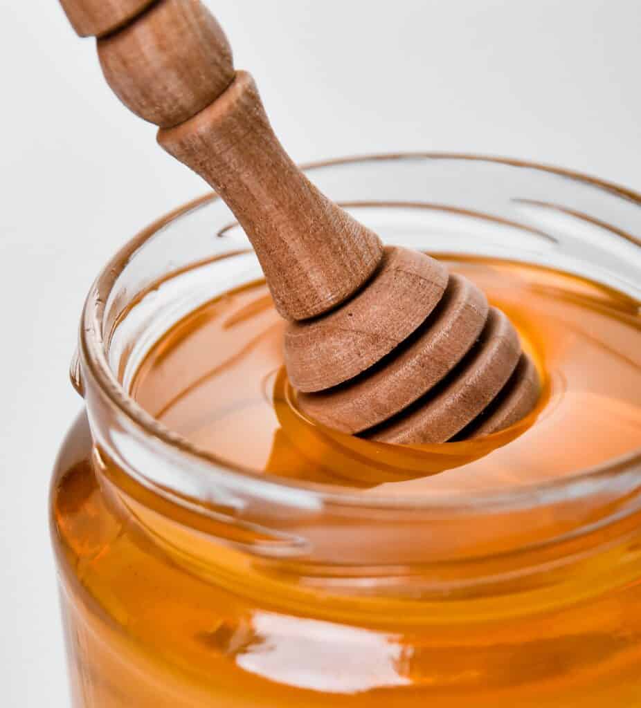 Use a wooden honey dipper for spreading honey on food