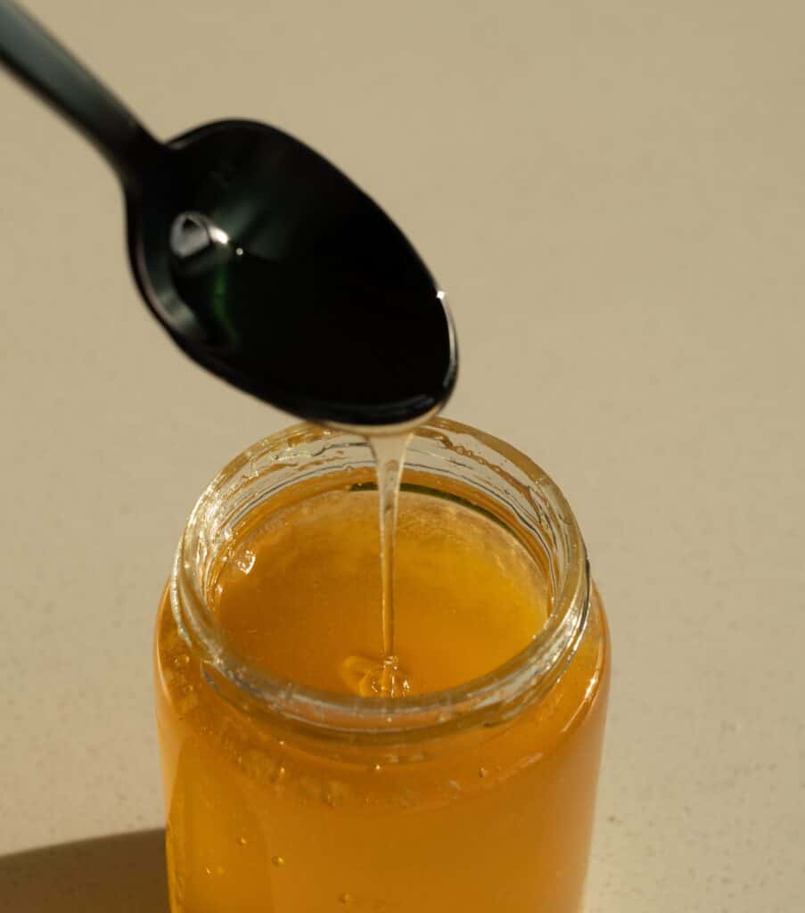 Using spoons instead of a wooden honey dipper